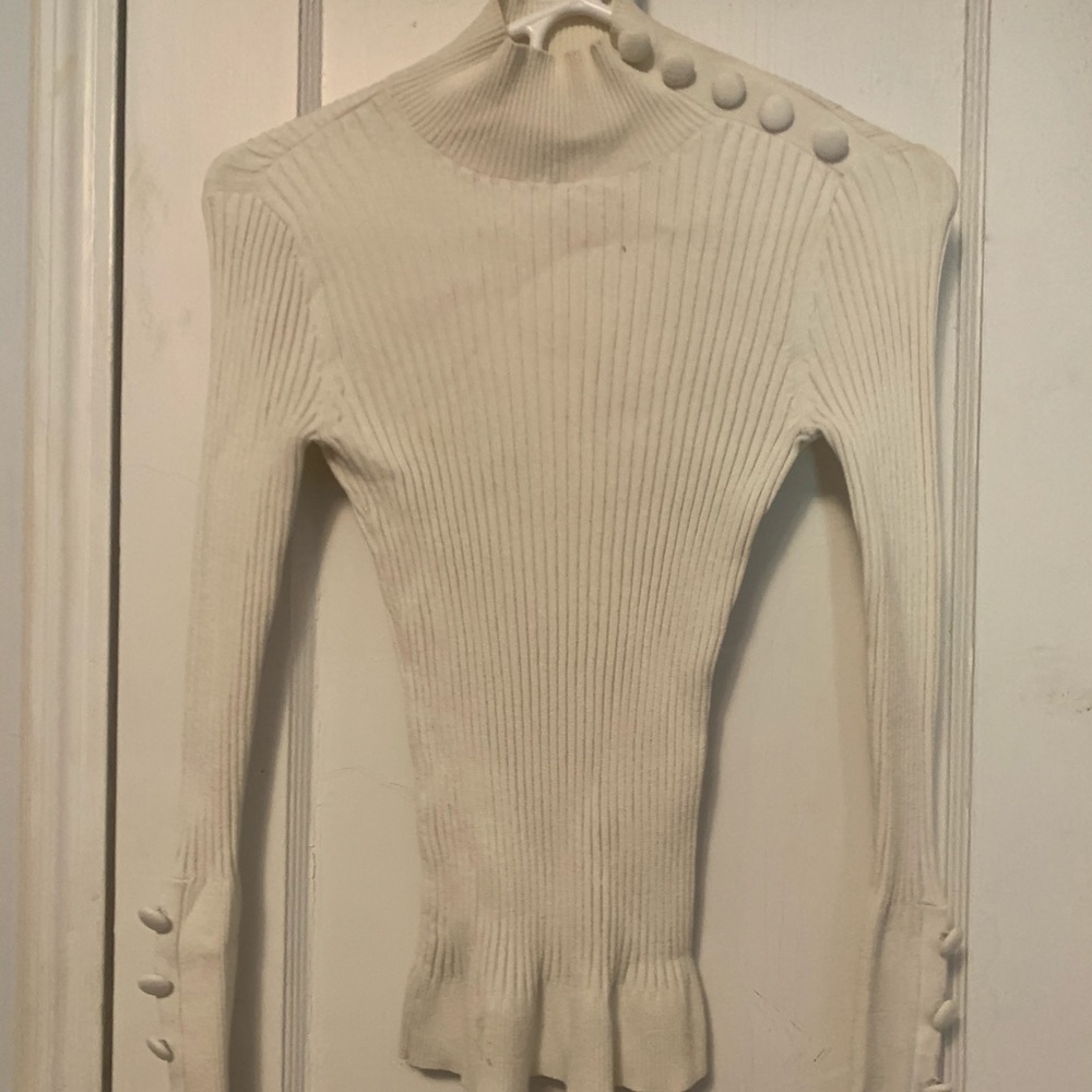 INC white turtleneck.